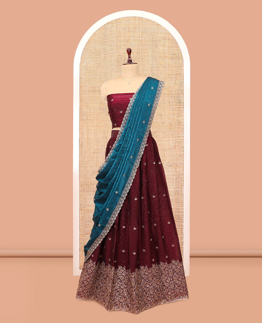 Wine Banarasi Half-Saree, Opulently Embellished with Embroidered Skirt, a Floral Embroidered Border, a Matching Blouse, and Contrast Scallop Embroidered Dupatta