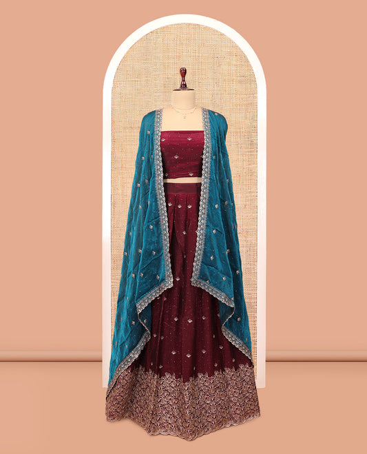 Wine Banarasi Half-Saree, Opulently Embellished with Embroidered Skirt, a Floral Embroidered Border, a Matching Blouse, and Contrast Scallop Embroidered Dupatta