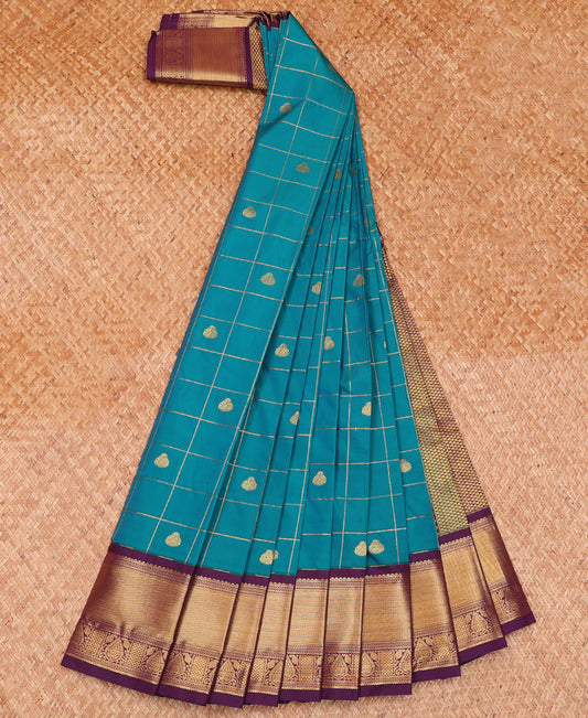 Blue Budget Silk Saree Accentuated with Zari Butta Enclosed Checks, Highlighted with Contrast Traditional Zari Design Border, Intricate Pallu, and a Paired with a Contrast Blouse