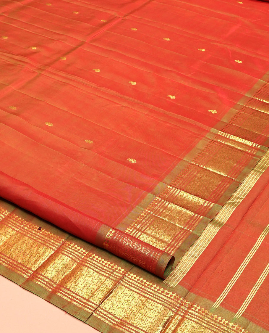 Orange Kanchipuram Silk Saree, Crafted with Zari Buttas, Complemented by a Contrast One-Sided Border of Panner Sombu, Banaras, Muthu, and Jaal Designs, Grand Pallu, and No Blouse