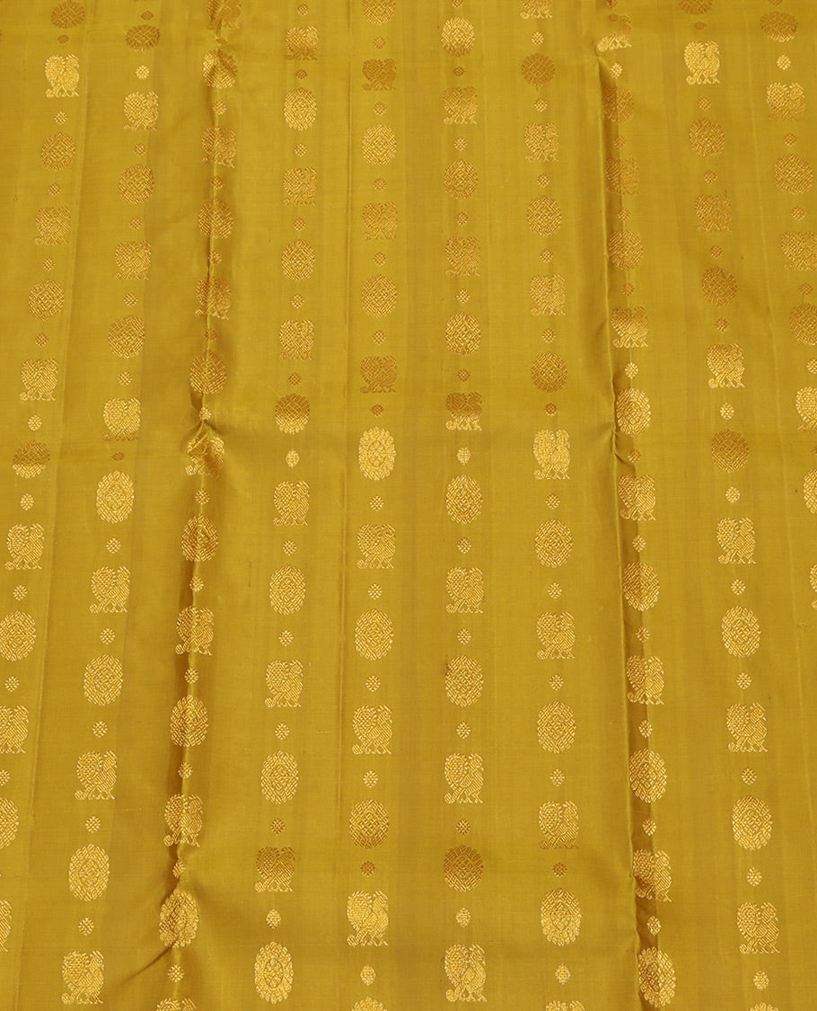 Green Pure Silk Half-Saree, Adorned with Mayil-Chakram Buttas All Over Its Skirt, Complemented by Contrast Border of Puli Nagam, Jaal, and Arumbu Manga Designs, Paired with a Contrast Blouse, and Comes with a Zari Design Woven Dhavani