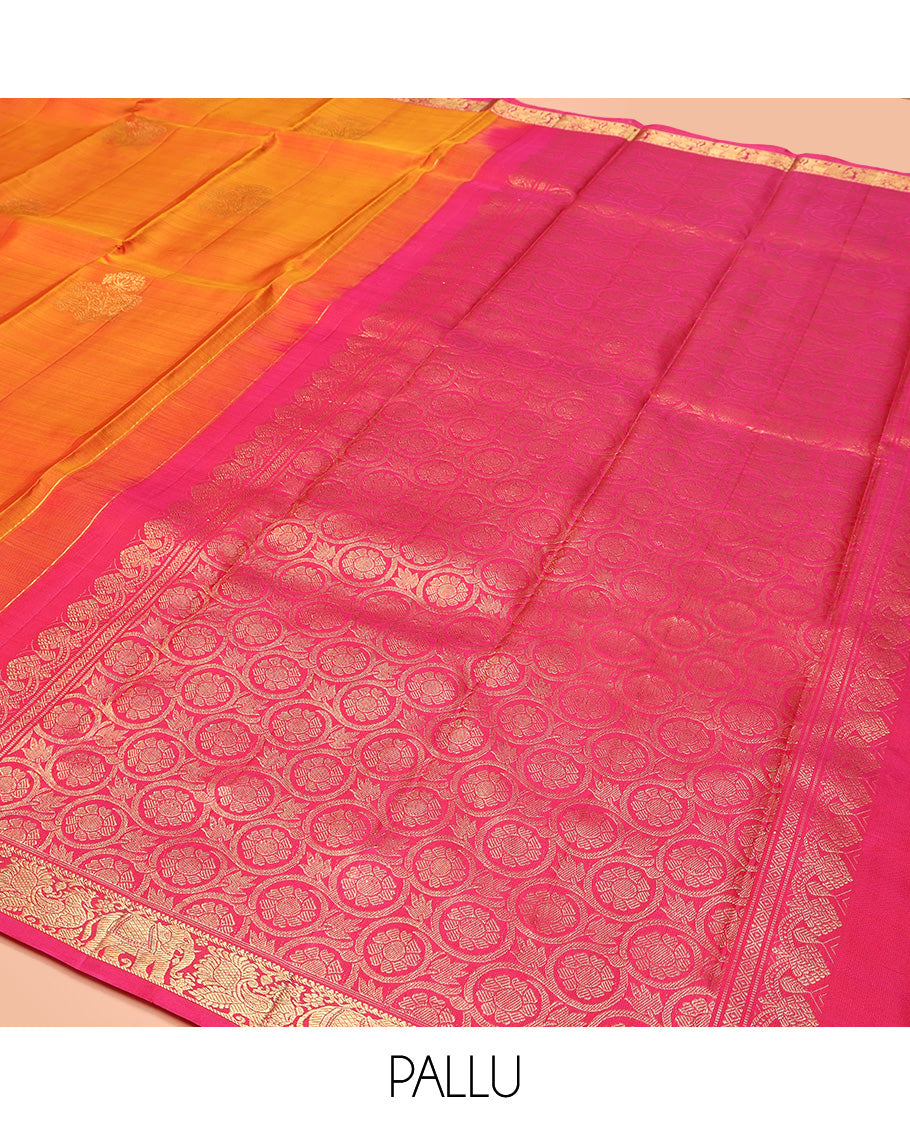 Orange Kanchipuram Silk Saree, Accentuated with Zari Buttas All Over Its Body, Complemented by Contrast Border of Yaanai and Mayil Designs, Grand Floral Jaal Pallu, and Paired with a Contrast Blouse