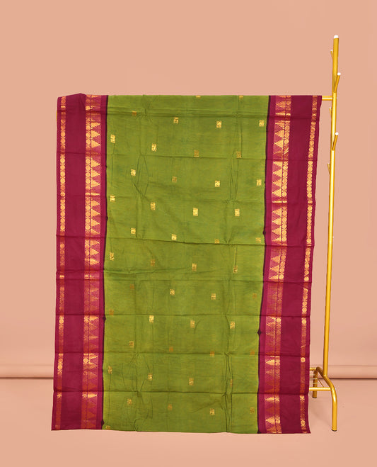Parrot Green Sungudi Cotton Saree, Ornamented with Zari Buttas on Its Body, Complemented by a Contrast Retttai Pettu Traditional Zari Design Border, Zari-Design Pallu, and Paired with a Contrast Blouse