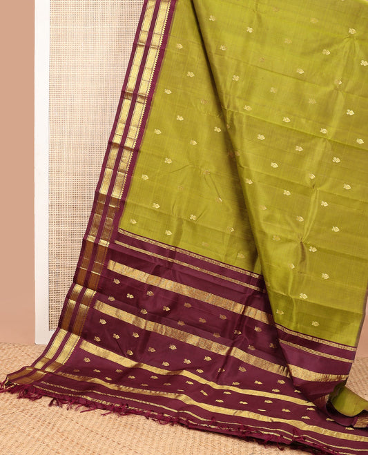 Green floral buttas kancheepuram silk saree with contrast korvai border of thilakam mokku, banaras, checked design & zari design pallu