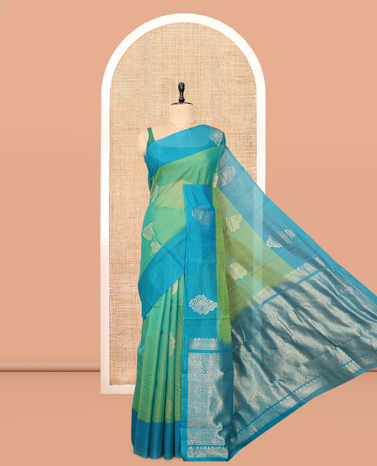 Green Cotton Saree, Accentuated with Zari Buttas, a Contrast Zari Butta Border, a Geometric Pallu, and a Contrast Blouse