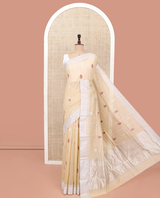 Sandal Chanderi Cotton Saree, Woven with Floral Buttas All Over Its Body, Highlighted by a Bavanji Border, Pallu Steeped with Zari Stripes, and Paired with a Matching Blouse