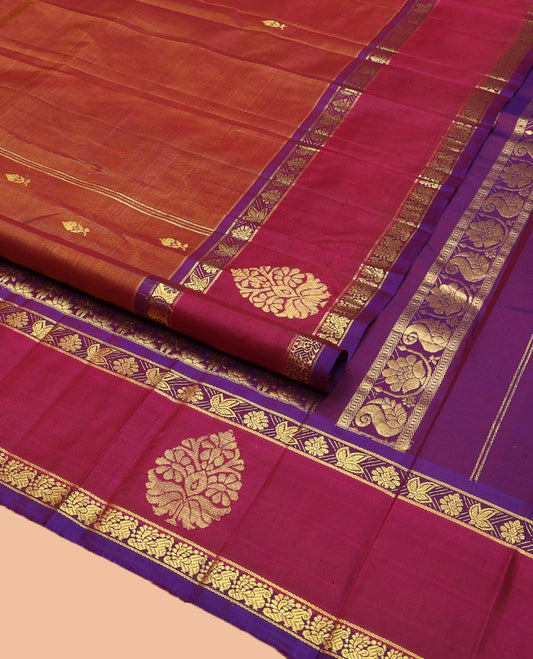 Brown Kanchipuram Silk Saree, Ornamented with Zari Buttas on Its Body, Complemented by a Contrast One-Sided Border of Floral and Peacock Designs, Pallu of Floral Zari Designs, and Comes Without a Blouse