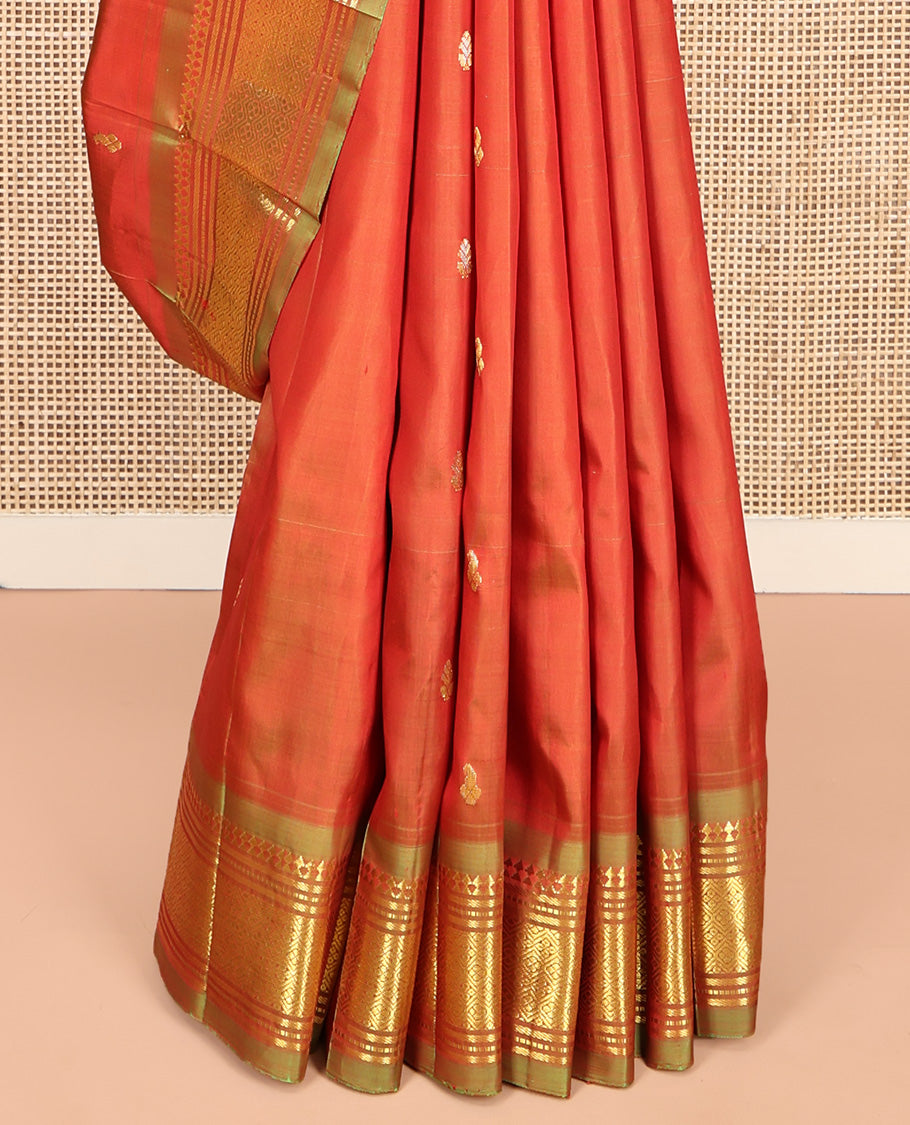 Orange Kanchipuram Silk Saree, Crafted with Zari Buttas, Complemented by a Contrast One-Sided Border of Panner Sombu, Banaras, Muthu, and Jaal Designs, Grand Pallu, and No Blouse