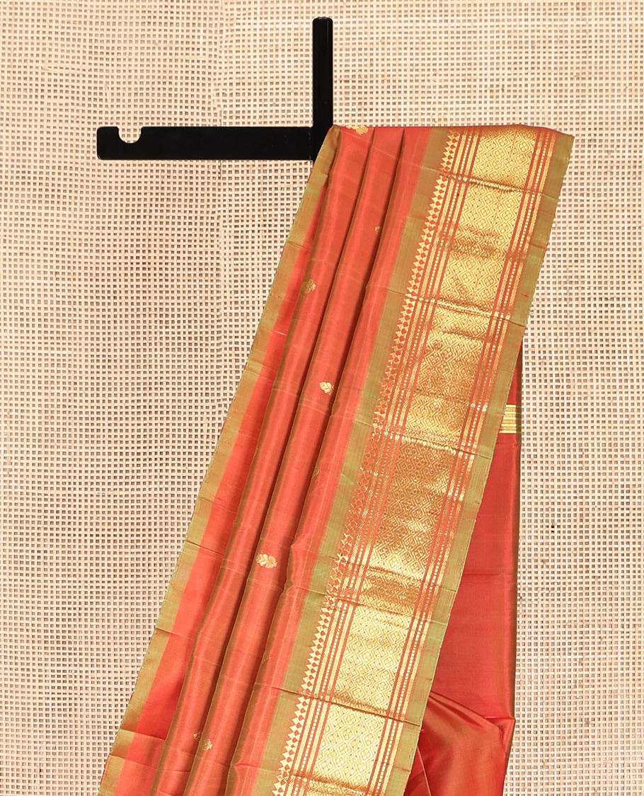 Orange Kanchipuram Silk Saree, Crafted with Zari Buttas, Complemented by a Contrast One-Sided Border of Panner Sombu, Banaras, Muthu, and Jaal Designs, Grand Pallu, and No Blouse