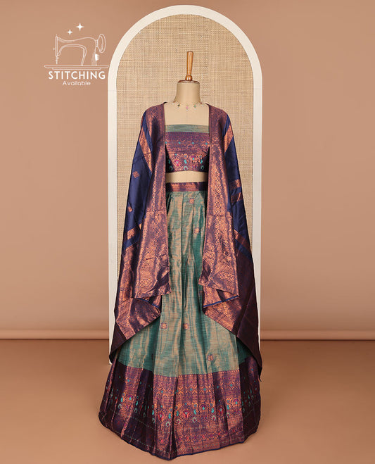 Green floral buttas half saree with contrast intricate zari design border, zari design blouse & floral zari design dhavavni
