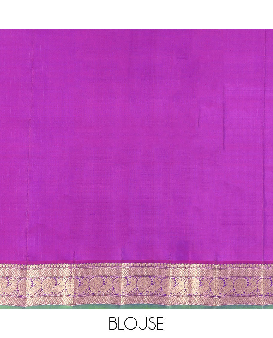 Blue Kanchipuram Silk Saree, Mesmerized with Zari Buttas All Over Its Body, Complemented by a Contrast Border of Thilakam, Mayil Kann, Muthu, and Mayil Designs, Grand Jaal Pallu, and Paired with a Contrast Blouse