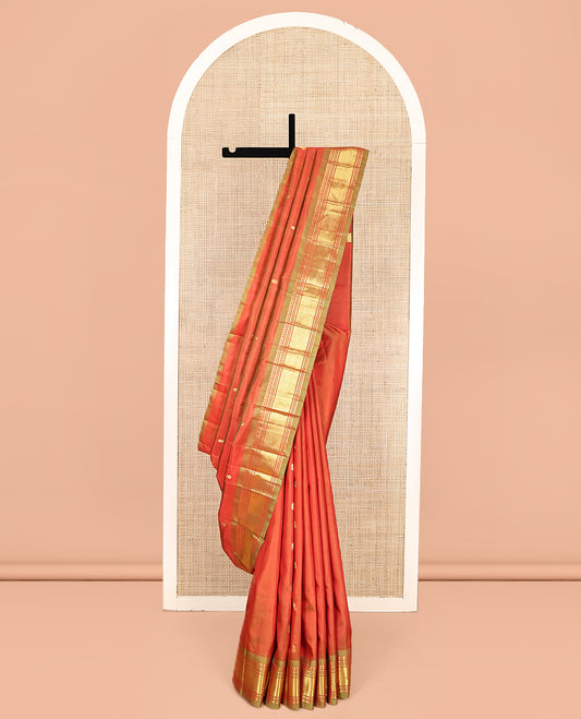 Orange Kanchipuram Silk Saree, Crafted with Zari Buttas, Complemented by a Contrast One-Sided Border of Panner Sombu, Banaras, Muthu, and Jaal Designs, Grand Pallu, and No Blouse
