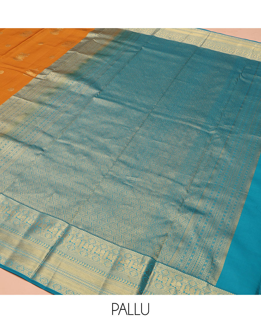 Orange Vasundhara Lite Silk Mix Saree, Detailed with Mayil, Chakra, and Iruthalai Pakshi Buttas, Complemented by Contrast Border of Thilakam Mokku, Mayil, Manga, Vanki, and Mayil Kann Designs, Opulently Embellished Jaal Pallu, and a Contrast Blouse