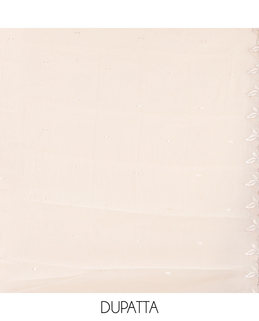Cream Mul Chanderi Material Churidar Features a Floral Outline Embroidered Top, a Santoon Bottom, a Scallop Threadwork Dupatta