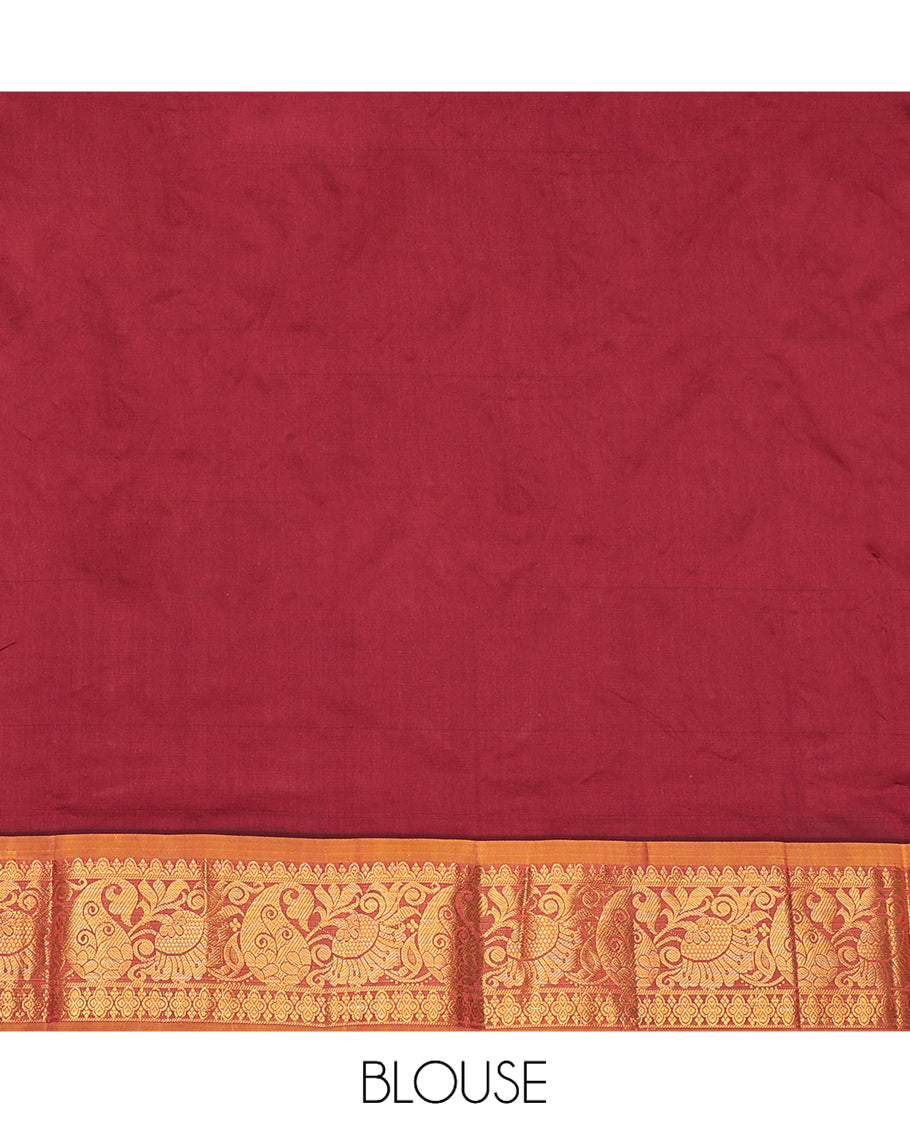 Maroon Art Silk Pavadai Material Set, Adorned with Zari Designs on Its Skirt, Complemented by a Contrast Traditional Zari Border, and a Matching Blouse