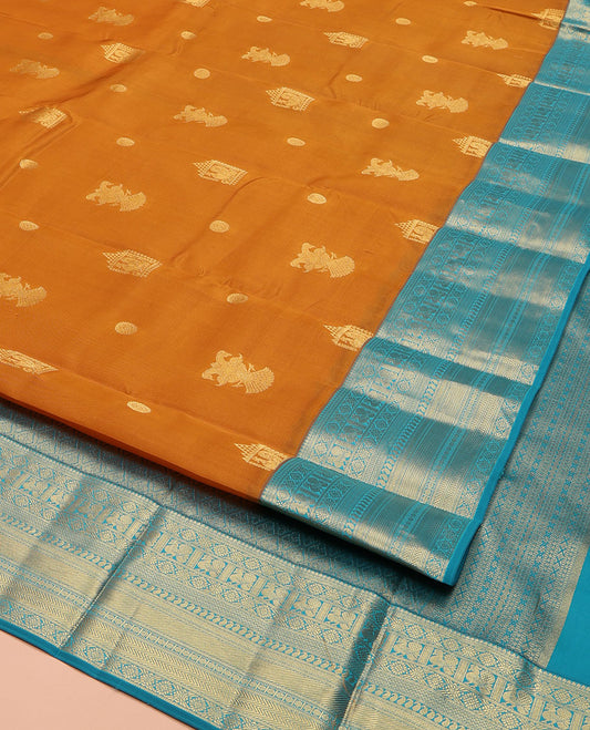 Orange Vasundhara Lite Silk Mix Saree, Detailed with Mayil, Chakra, and Iruthalai Pakshi Buttas, Complemented by Contrast Border of Thilakam Mokku, Mayil, Manga, Vanki, and Mayil Kann Designs, Opulently Embellished Jaal Pallu, and a Contrast Blouse