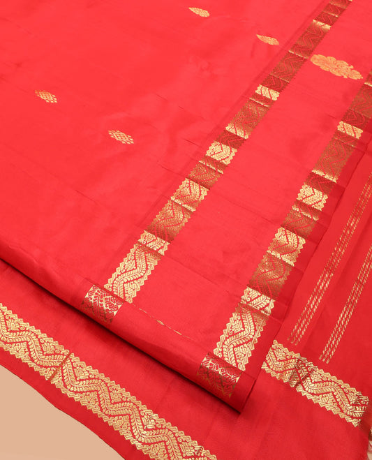 Red Kanchipuram Silk Saree, Detailed with Zari Buttas, Highlighted by a One-Sided Rettai Pettu Zari Border, Floral Design Pallu, and a No Blouse