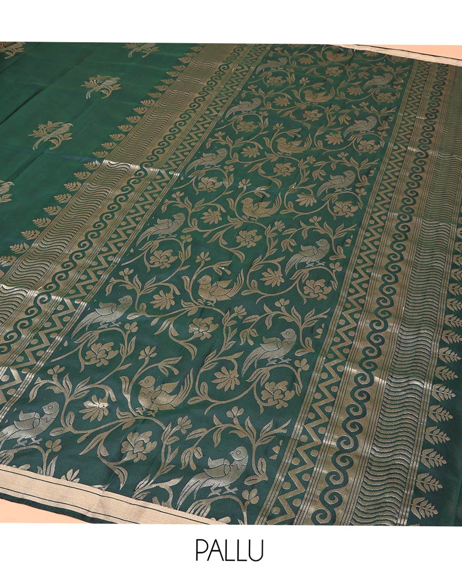 Green Mayuri Soft Silk Saree, Bedecked with Bird Buttas All Over Its Body, Highlighted by Zari Piping Border, Pallu of Floral Jaal and Bird Designs, and Paired with a Matching Blouse
