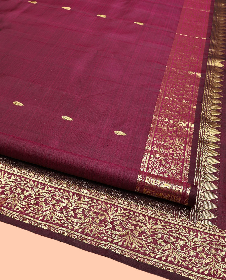 Wine Kanchipuram Silk Saree, Embellished with Zari Buttas on Its Body, Highlighted by a Zari Border of Floral Designs, Pallu of Jaal Designs, and Paired with a Matching Blouse