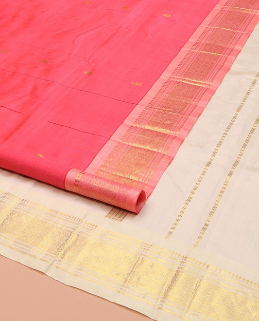 Pink Kanchipuram Silk Saree, Woven with Zari Buttas on Its Body, Complemented by a Contrast One-Sided Border of Paneer Sombu, Banaras, Muthu and Jaal Designs, Pallu of Zari Designs, and Comes Without a Blouse