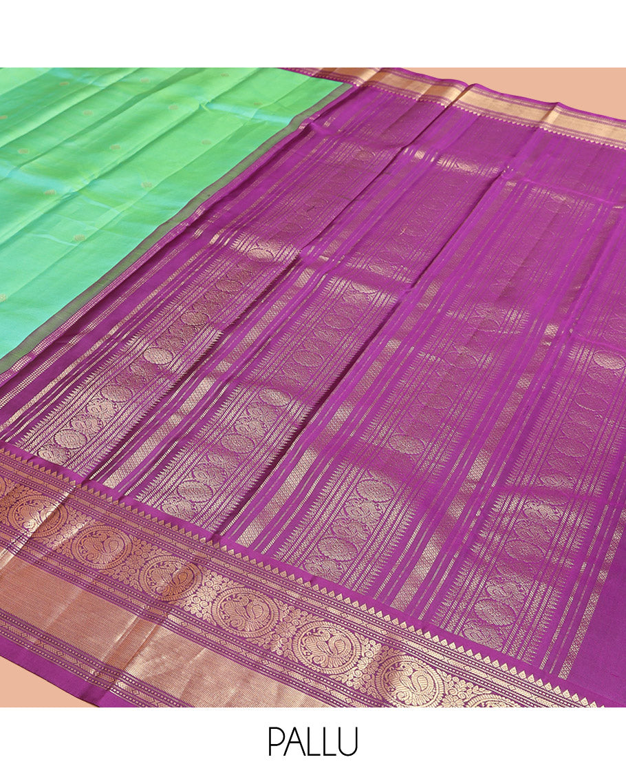 Rexona Green Vasundhara Silk Saree, Beautified with Sparse Stripes and Zari Buttas, Complemented by a Contrast Border of Thilakam, Banaras, Muthu, and Round Mayil Designs, Pallu Steeped with Traditional Designs, and Paired with a Contrast Blouse