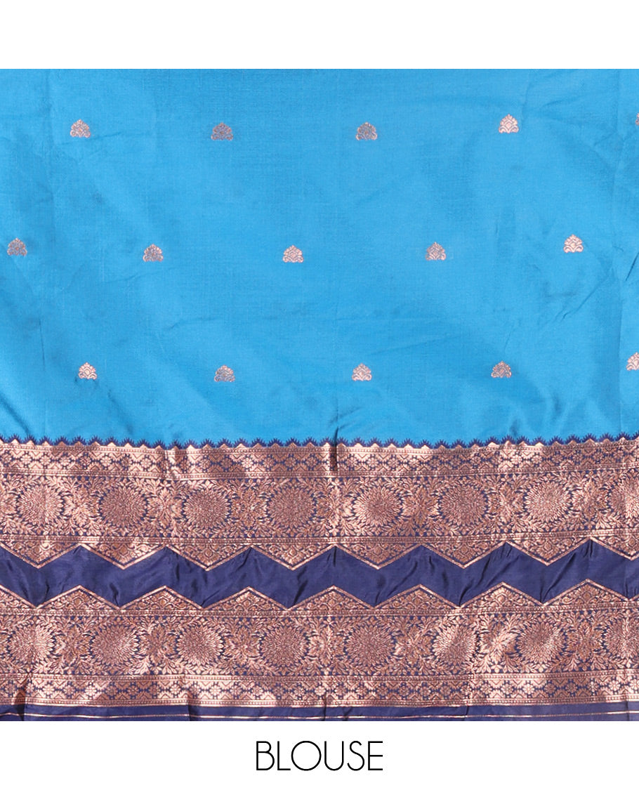 Light Blue and Navy Blue Semi-Banarasi Half-Saree Adorned with Zari Buttas on Its Skirt, Complemented by Contrast Traditional Zari Border of Chakram Designs, Paired with a Matching Blouse, and a Satin Georgette Embroidered Scallop Dhavani