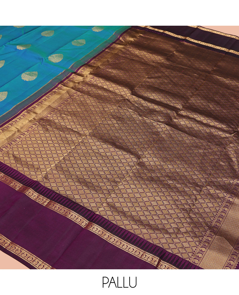 Blue Vasundhara Silk Saree, Delicately Woven with Zari Buttas All Over Its Body, Complemented by a Contrast Rettai Pettu Temple Border of Banaras, and Manga Designs, Grand Jaal Pallu, and Paired with a Contrast Blouse