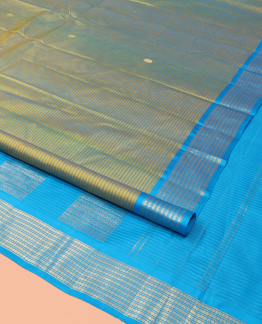 Green Kanchipuram Silk Saree Adorned with Vazhaipoo Stripes and Zari Buttas, Complemented by Contrast Border of Banaras and Lavangam Designs, Subtly Zariwoven Pallu, and Paired with a Contrast Blouse