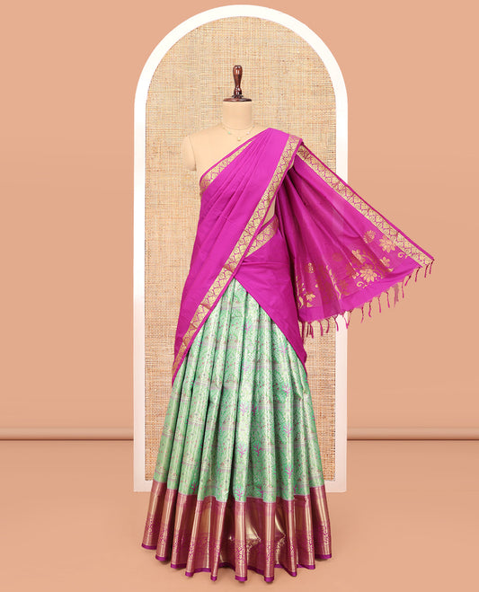 Green Art Silk Material Half Saree Set, Embellished with Jacquard Design Skirt, a Contrast Traditional Zari Design Border, Contrast Zari-Jacquard Blouse, and a Dhavani of Floral Designs