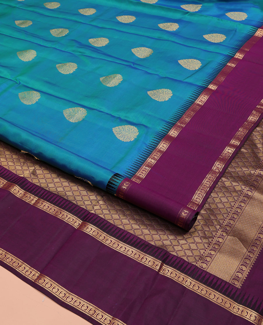 Blue Vasundhara Silk Saree, Delicately Woven with Zari Buttas All Over Its Body, Complemented by a Contrast Rettai Pettu Temple Border of Banaras, and Manga Designs, Grand Jaal Pallu, and Paired with a Contrast Blouse