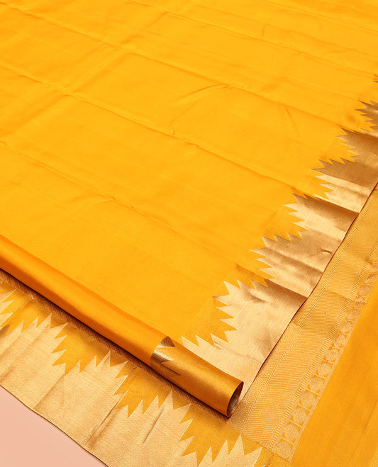 Yellow Plain Kanchipuram Silk Saree, Highlighted by a Zari Thazampoo Rekku Border, Diagonally Striped Pallu, and a Matching Blouse