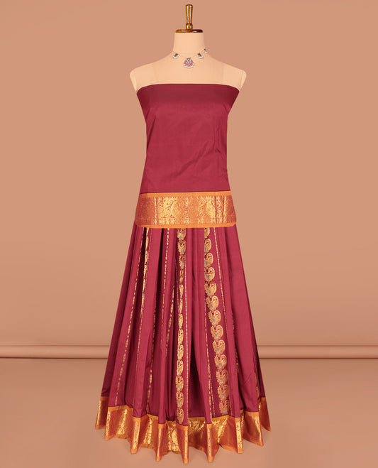 Maroon Art Silk Pavadai Material Set, Adorned with Zari Designs on Its Skirt, Complemented by a Contrast Traditional Zari Border, and a Matching Blouse
