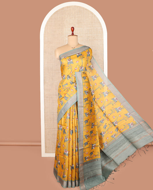 Yellow Pichwai cow and lotus motifs printed tussar silk saree, contrast traditional zari border, and striped pallu