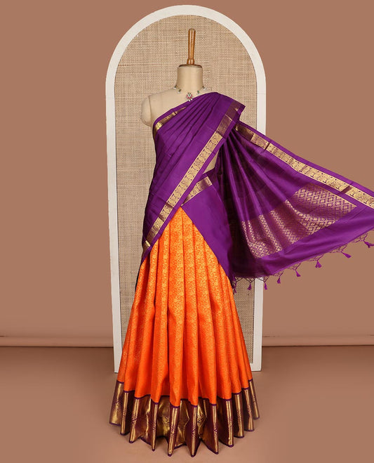 Orange pure silk half saree, jacquard skirt, contrast korvai border of thilakam mokku, paisa, and diamond designs, and jaal dhavani