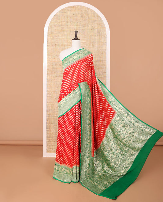 Red khaddi georgette saree with buttas, contrast intricate pallu & border steeped with traditional designs
