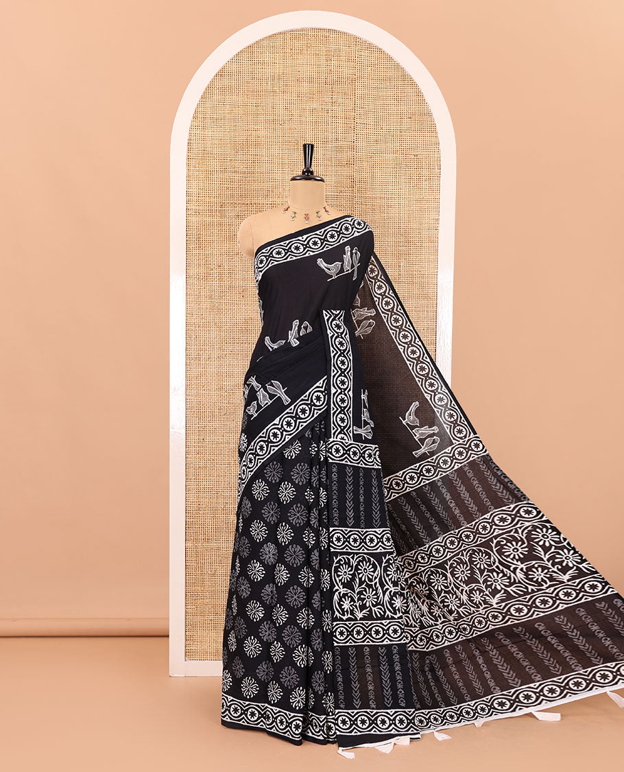 Black sparrow motifs hand block printed soft mul cotton, block printed border, pallu of floral-geometric print, and a hand block printed blouse