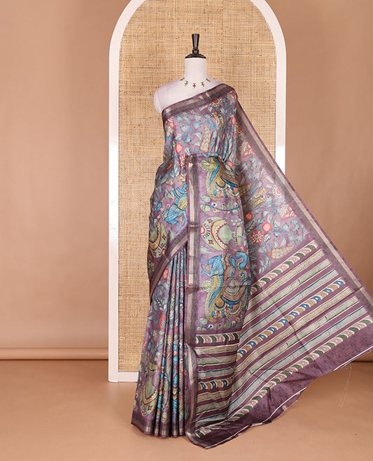 Violet-base multi-color kalamkari floral-vine and peacocks printed semi-tussar saree, gold zari piping border, kalamkari printed pallu, and contrast printed blouse