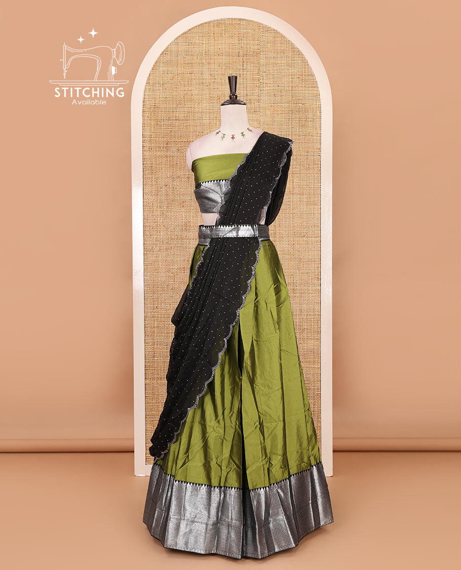 Green-black taffeta silk half-saree, plain & contrast temple & kathir boder skirt, matching blouse & contrast stonework scallop border syska georgette dhavani