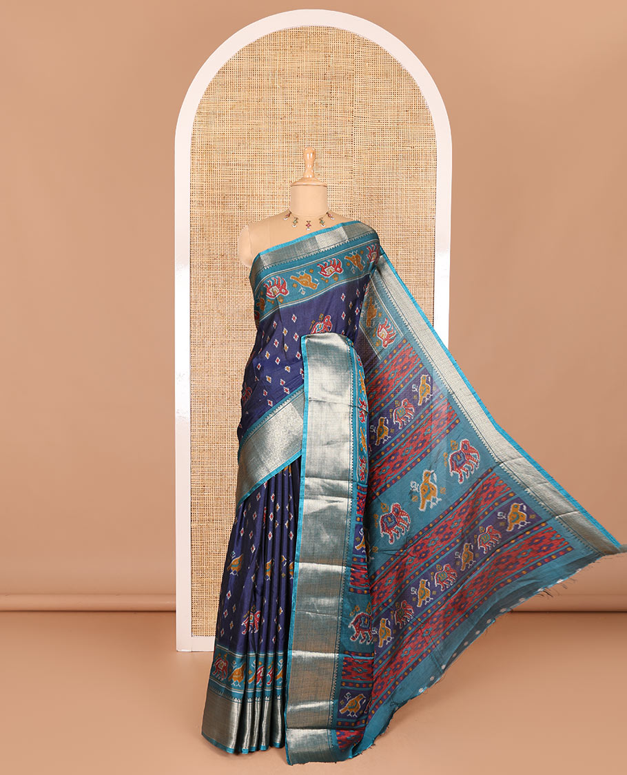 Navy blue patola elephant motifs printed Dola silk saree, contrast zari border, and pallu of animal patola motifs print, and a contrast butta printed blouse