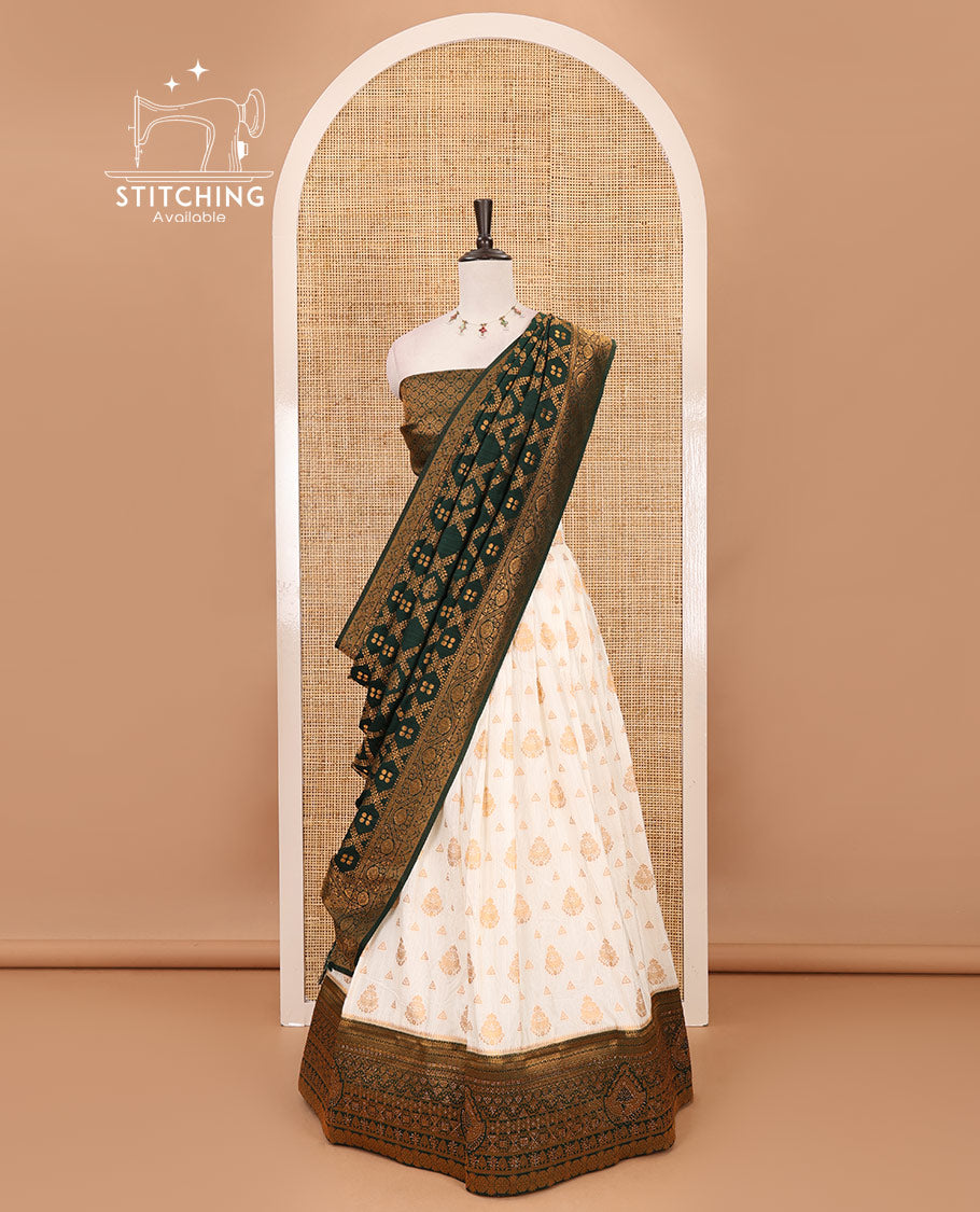 Cream georgette crepe half saree,zari buttas & traditional Swarovski stonework bottle green border skirt, jacquard blouse & banarasi jacquard dhavani
