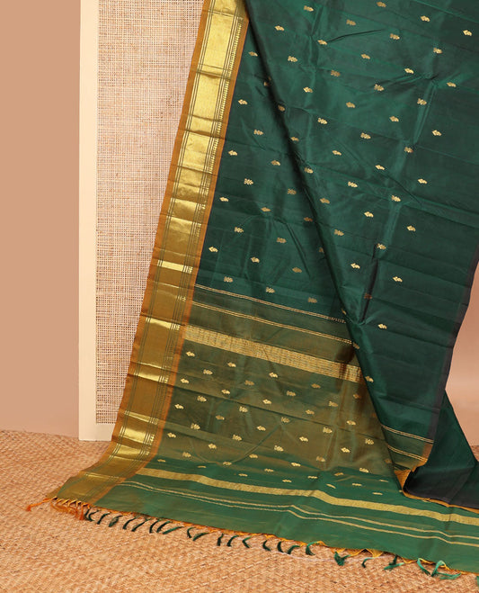 Bottle green buttas kancheepuram silk saree with contrast border of thilakam, mokku, banaras, kuyil kann design border & zari design pallu