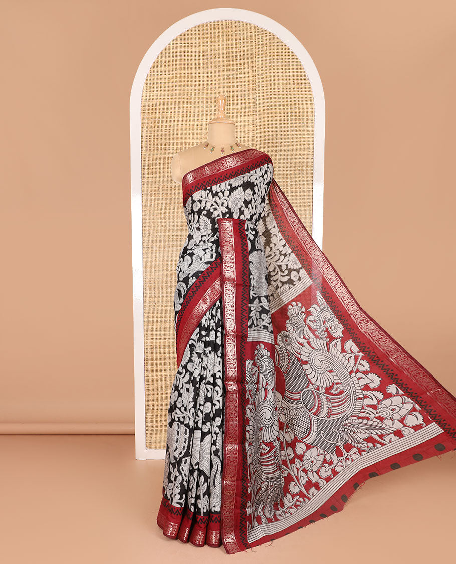 Black kalamkari floral vine and peacock printed muslin cotton saree, contrast zari border, kalamkari peacock printed pallu, and a contrast coin buttas printed blouse
