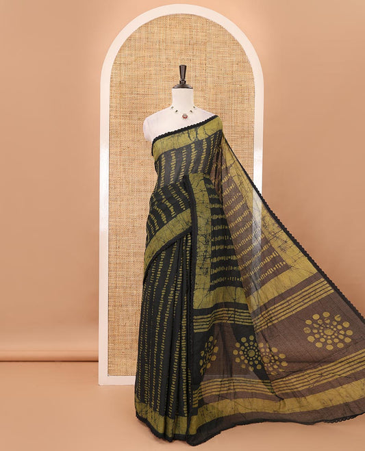 Black handblock wax batik printed kota check saree, contrast batik print lacework border, batik print pallu & polka dots print blouse