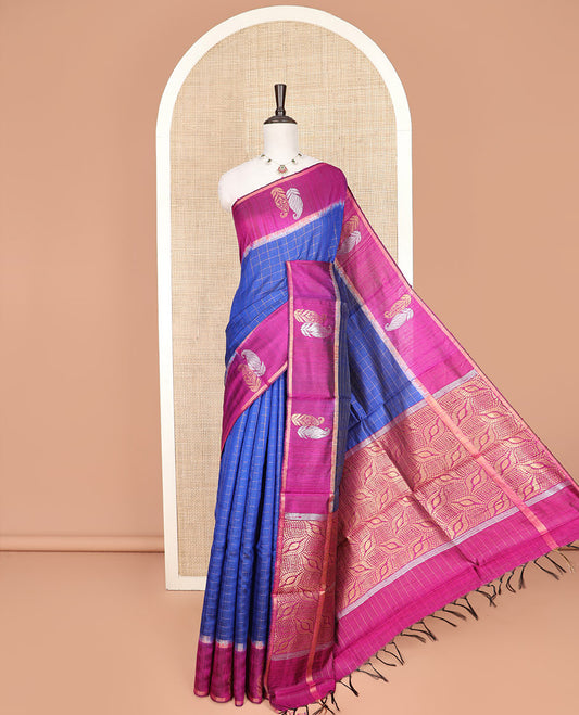 Blue Dupion Silk Saree Embellished with Checks All Over Its Body, Complemented by a Contrast Border of Paisley Motifs in Zari, Grandly Woven Pallu of Ogee Designs, and Paired with a Contrast Blouse