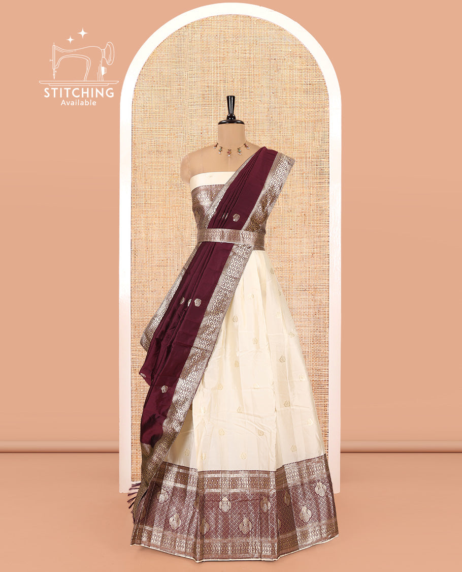 Cream-Wine Semi-Banarasi Half-Saree Set Featuring Buttas Skirt, Contrast Traditional Border, a Matching Blouse, and a Banaras Dhavani