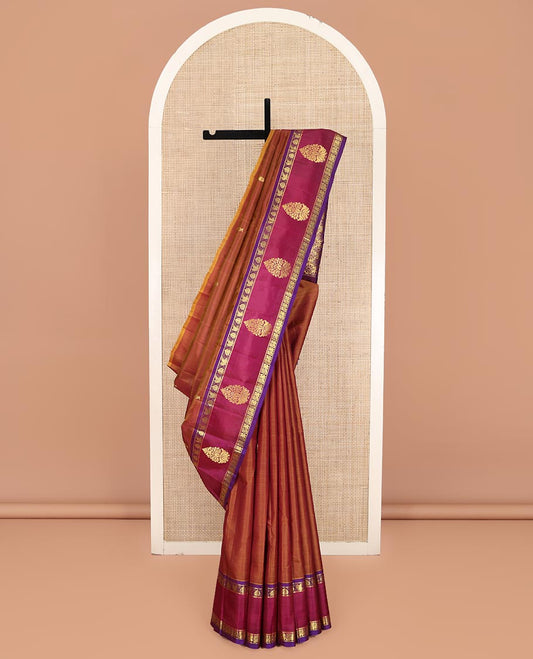 Brown Kanchipuram Silk Saree, Ornamented with Zari Buttas on Its Body, Complemented by a Contrast One-Sided Border of Floral and Peacock Designs, Pallu of Floral Zari Designs, and Comes Without a Blouse