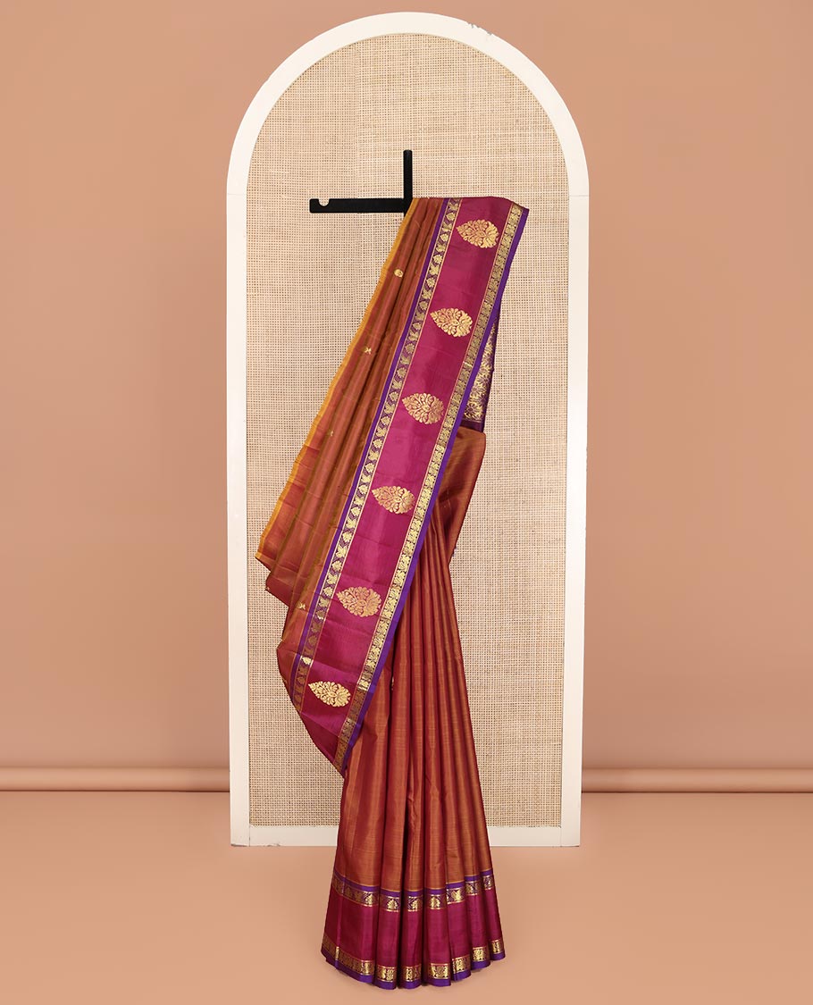 Brown Kanchipuram Silk Saree, Ornamented with Zari Buttas on Its Body, Complemented by a Contrast One-Sided Border of Floral and Peacock Designs, Pallu of Floral Zari Designs, and Comes Without a Blouse