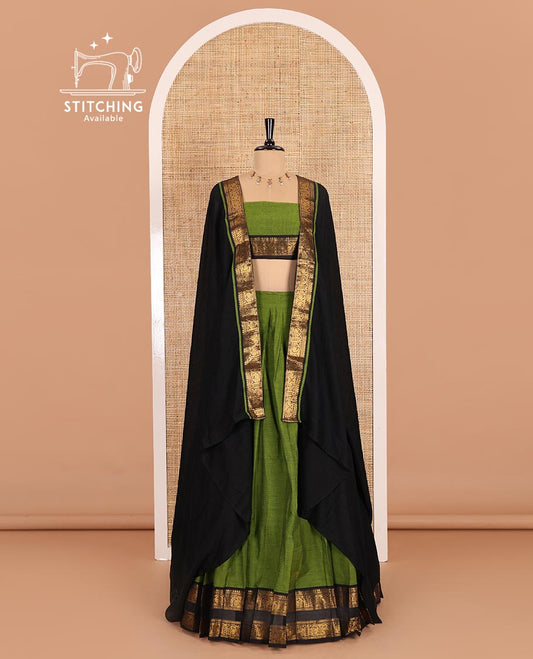 Green-black sungudi cotton saree, buttas with contrast peacock motifs woven traditional bordered skirt, a matching blouse, and a zari bordered dhavani