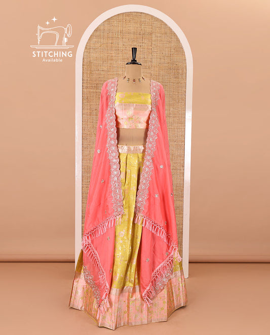 Yellow banarasi half-saree, floral jaal thread weave with contrast floral thread bordered skirt, a matching blouse, and scallop embroidered dhavani with belt