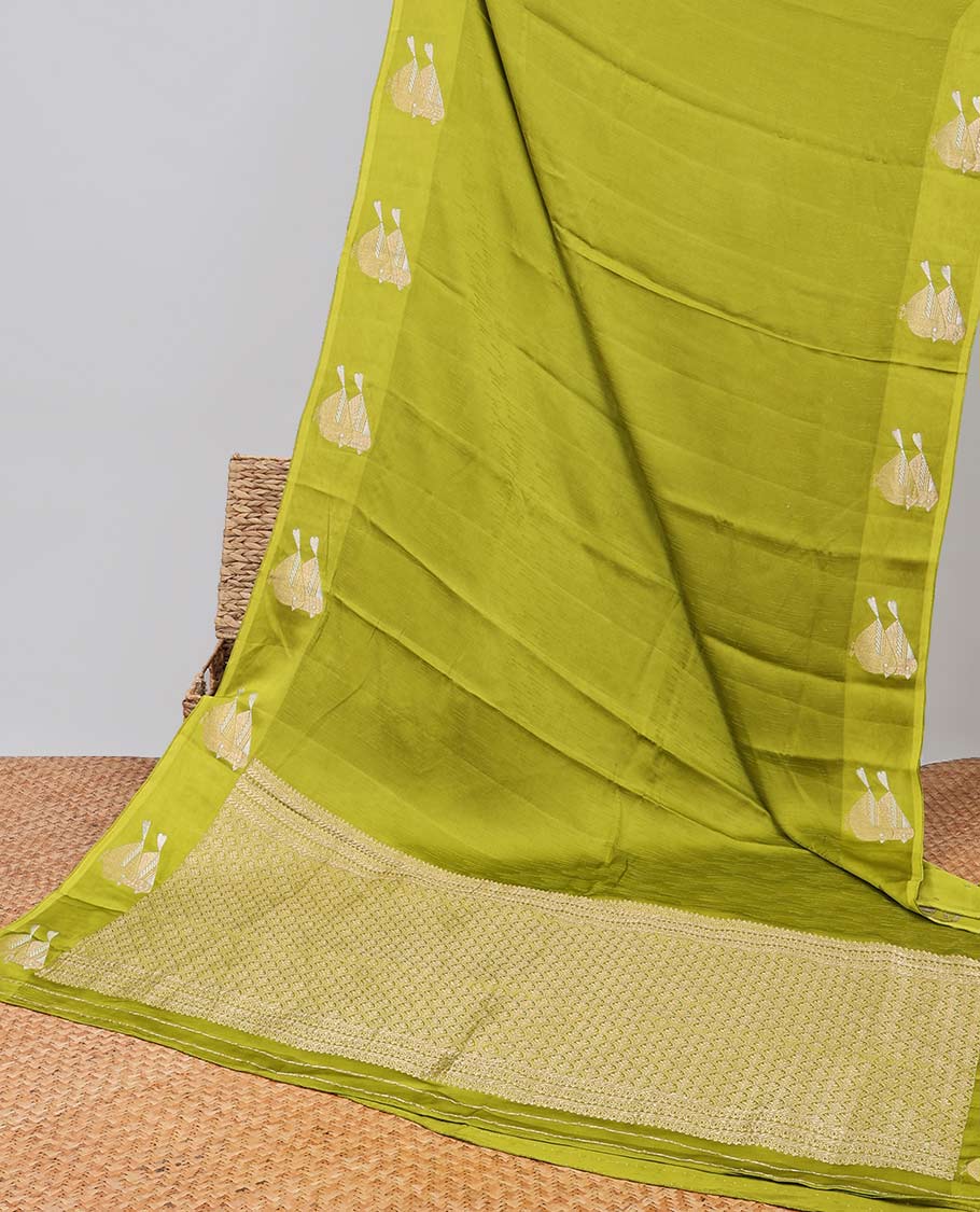 Green mushru silk saree with self bird motifs border & pallu of argyle pattern